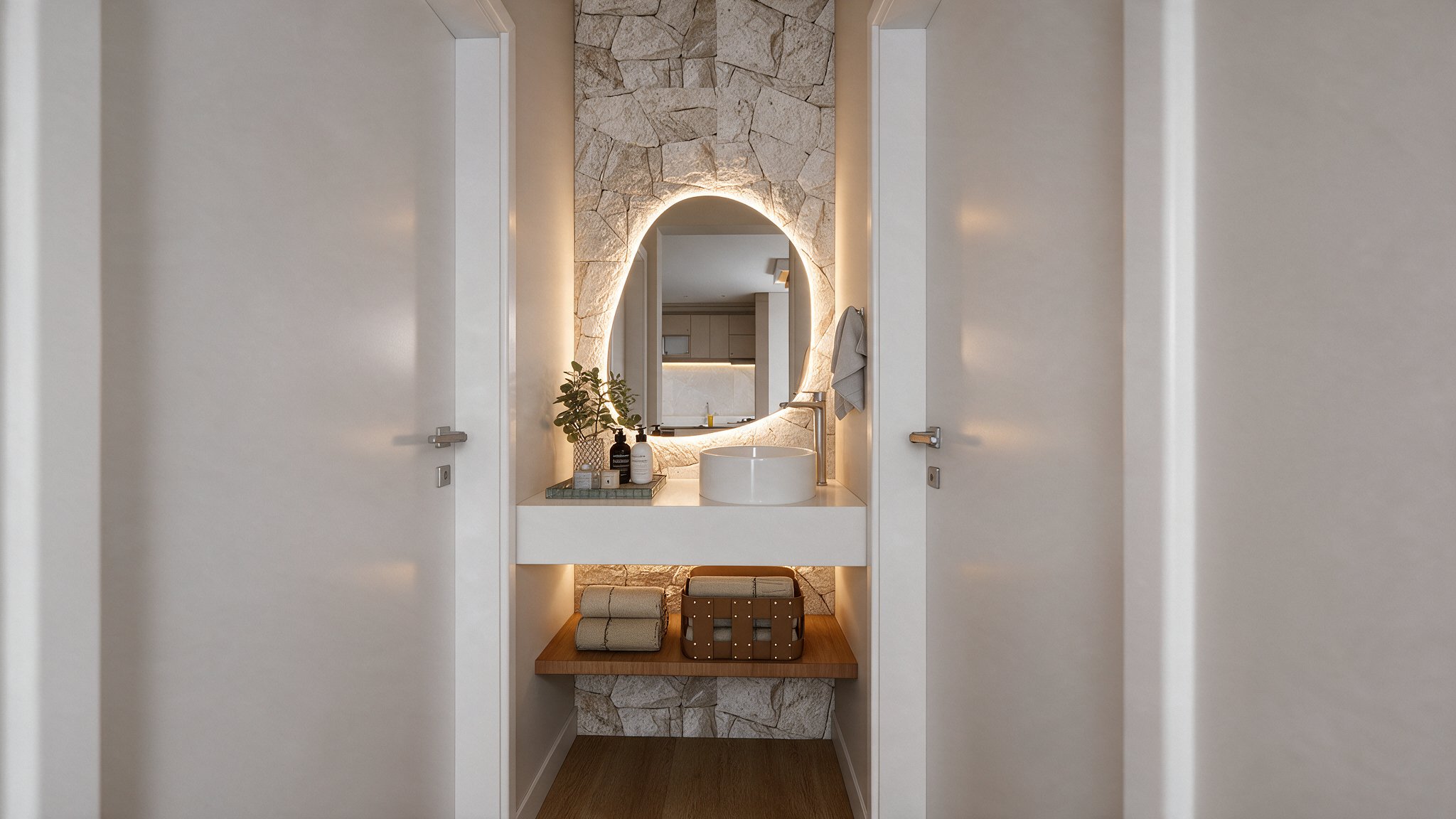 Lavatory with stone wall, backlit organic mirror and round basin