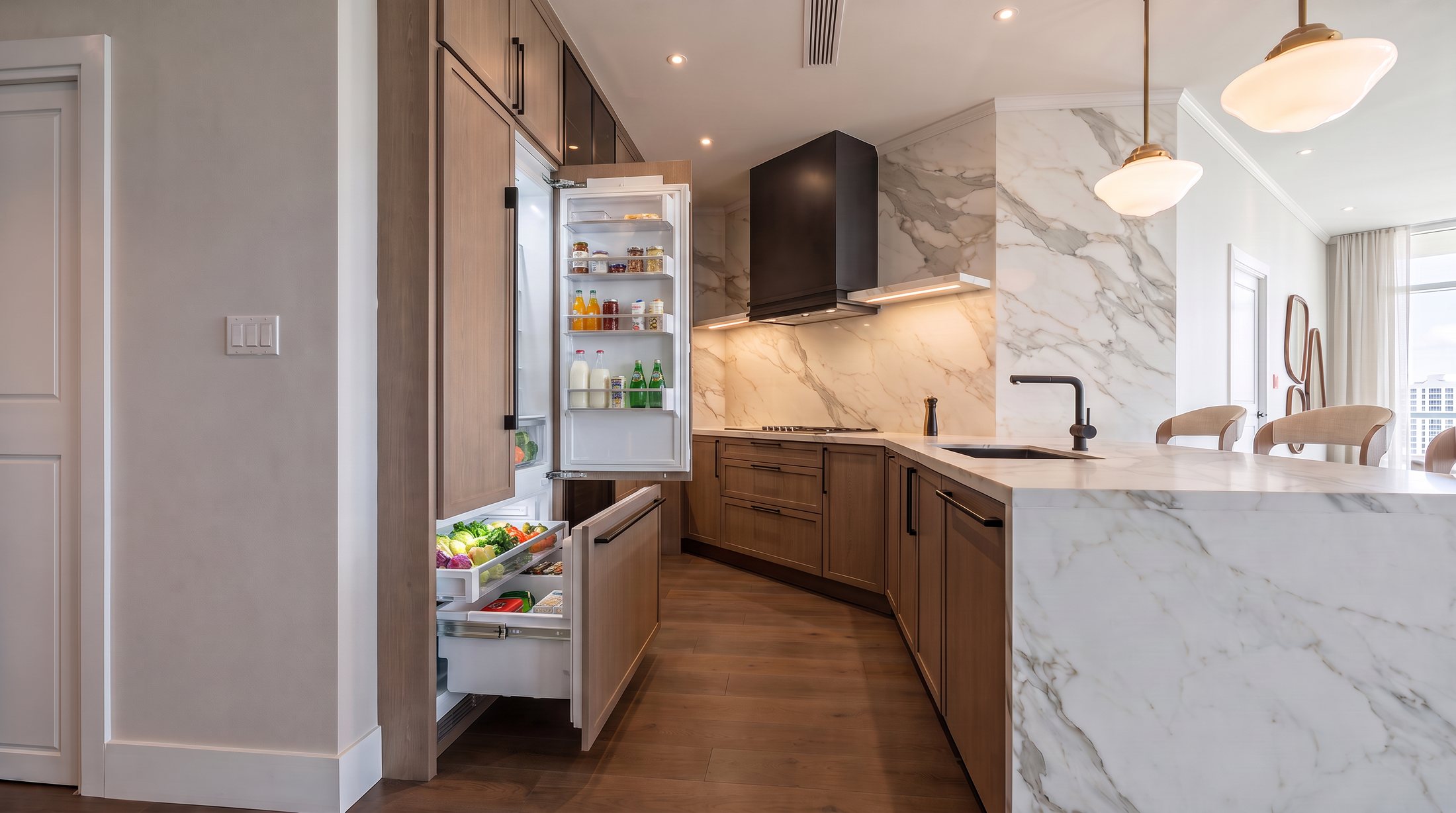 Kitchen with integrated refrigerator open